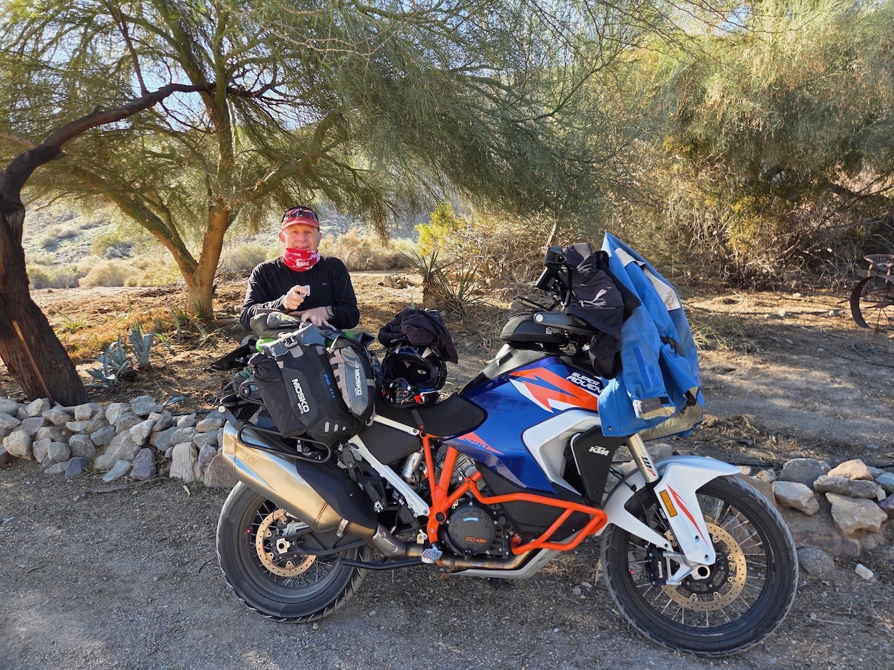 Rider with loaded KTM 1290 at date ranch desert