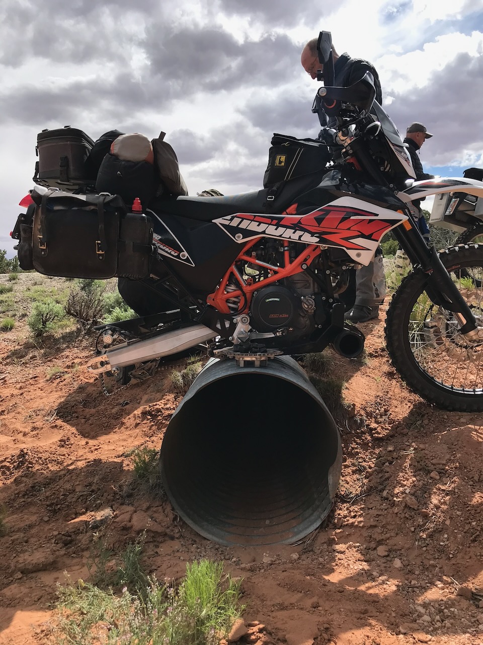KTM 690 Enduro with flat tire on red dirt trail Blaine