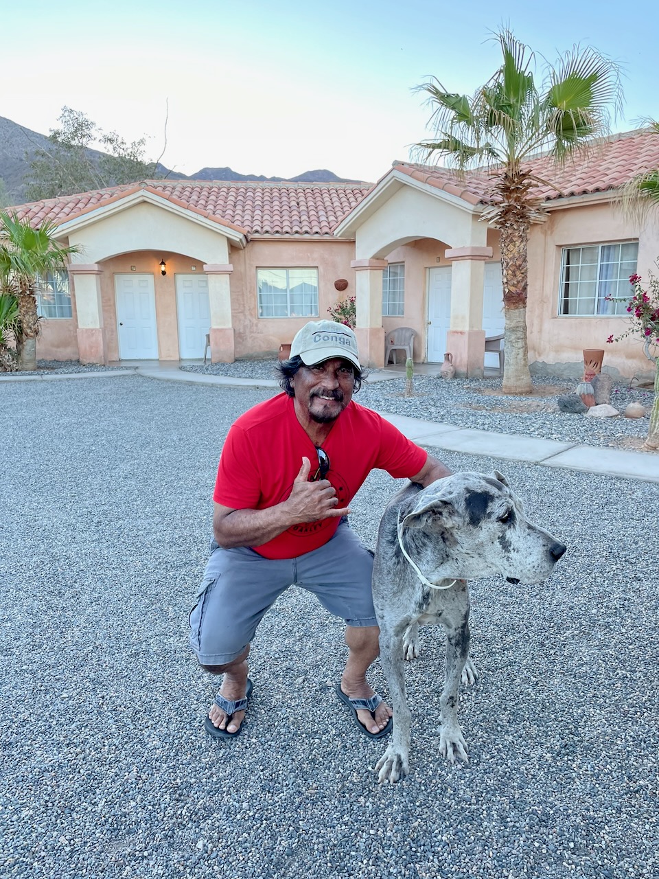 Man in red shirt with Great Dane Baja casita