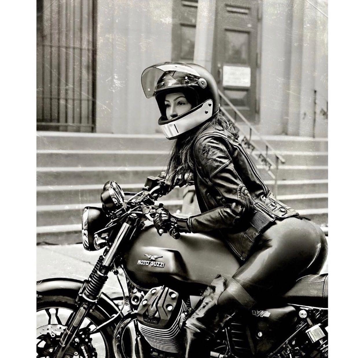 Woman in leather jacket on Moto Guzzi V7 black and white photo